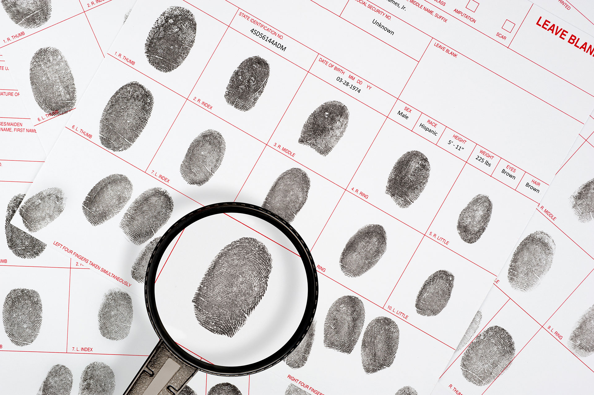 fingerprints-on-the-papers-magnifying-glass